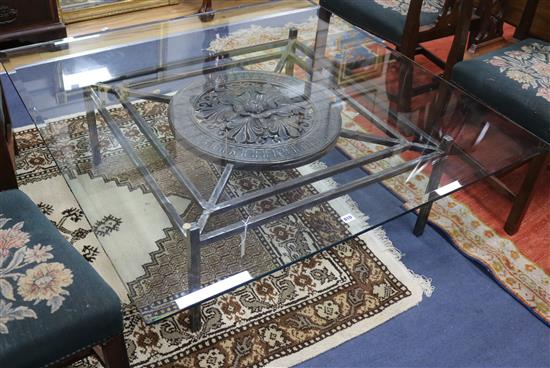 A modern wrought iron coffee table with glass top W.130cm